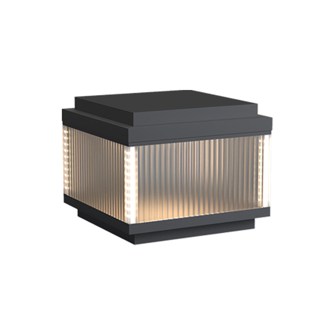 Compact square pillar lighting outdoor fixture with ribbed glass and a matte black top cover.