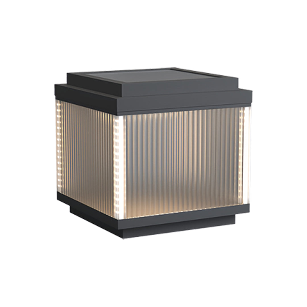 Dark-top pillar lighting outdoor lamp with vertically textured glass for diffused lighting.