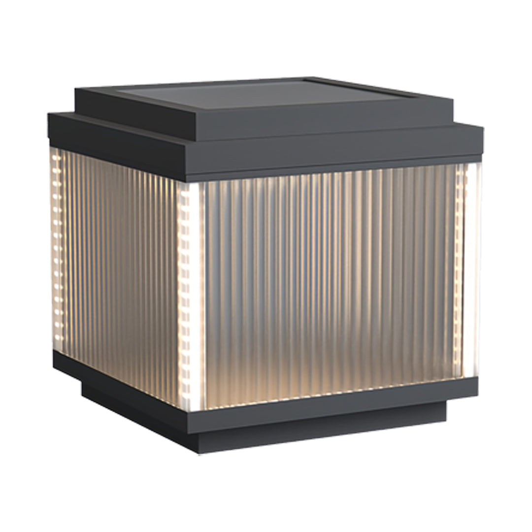 Large pillar lighting outdoor design with a wide square frame and evenly glowing ribbed glass.