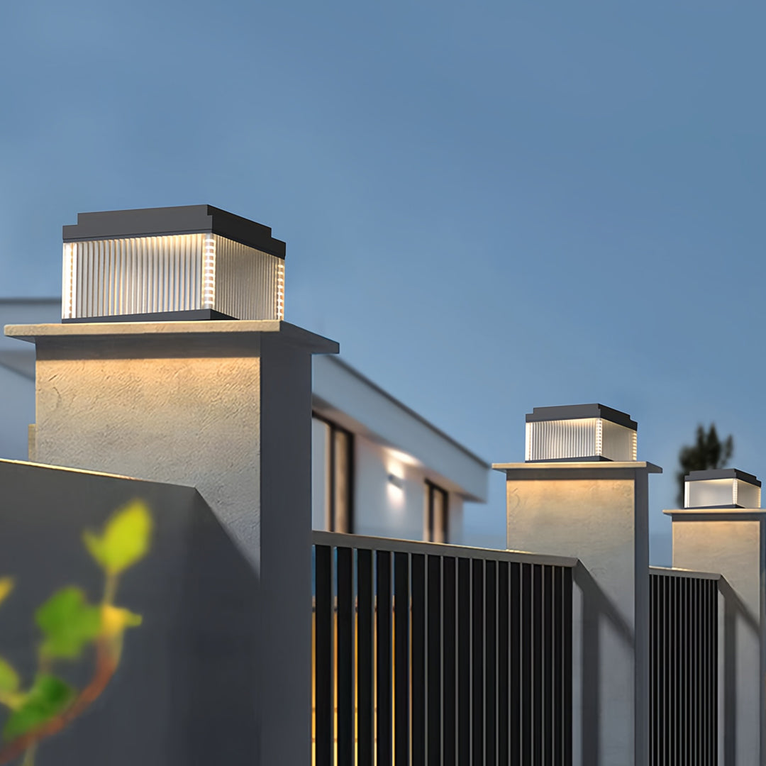 Pillar lighting outdoor lamp illuminating a modern exterior with clean vertical light diffusion.