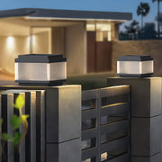 Pillar lighting outdoor mounted on a modern gate post, emitting warm architectural lighting.