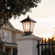 Pillar lights for house illuminating a garden pathway, creating a warm and inviting entrance.