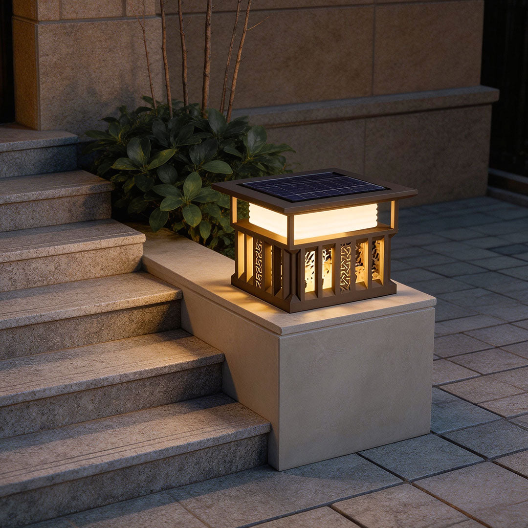 Stylish pillar lights for house mounted on stone pillars beside a set of outdoor stairs.