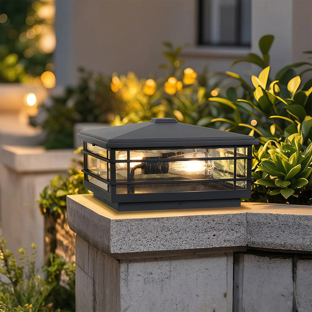Pillar lights outdoor mounted on stone column beside garden greenery creating elegant evening illumination