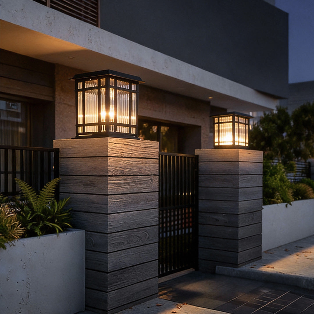 Pillar solar light installed on a contemporary gate pillar, enhancing entrance lighting with a classic lantern-inspired design.