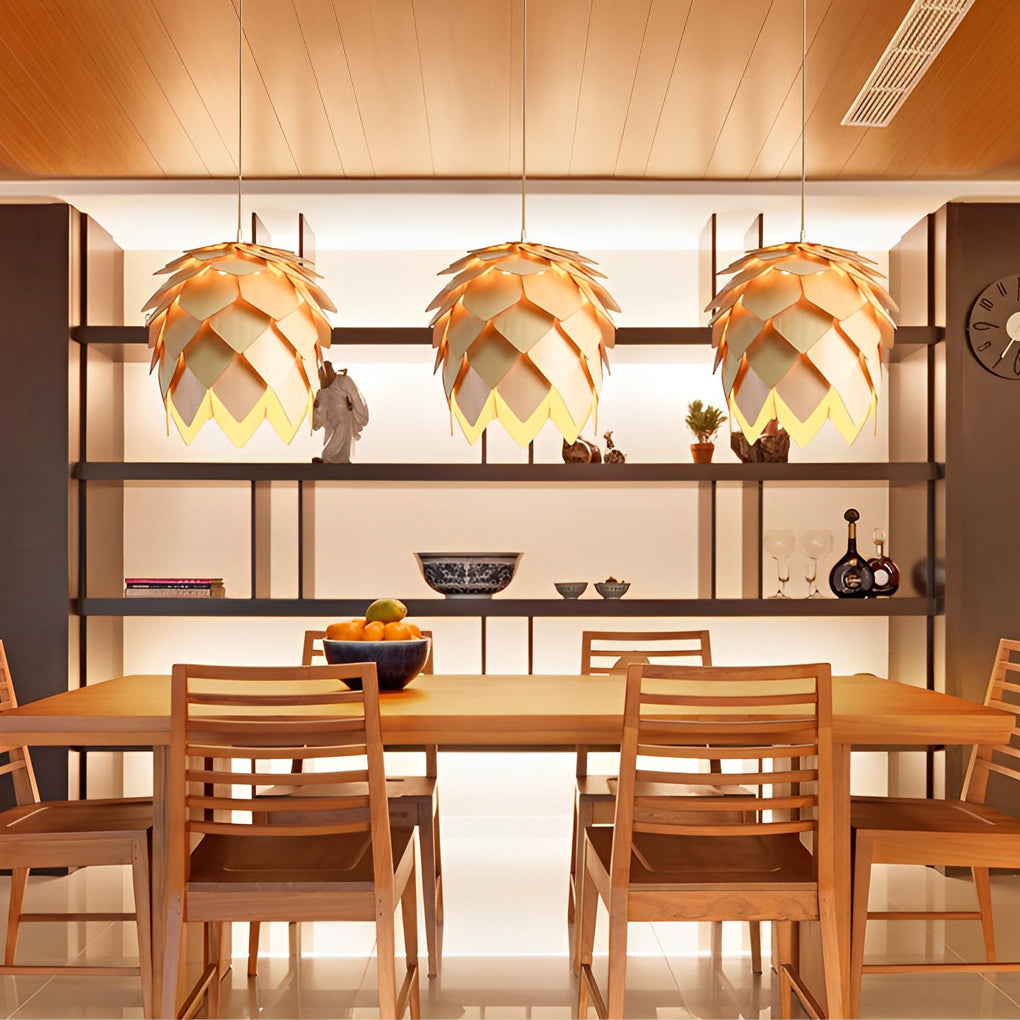 Pinecone pendant light with a close-up of its layered wooden structure and glowing light.