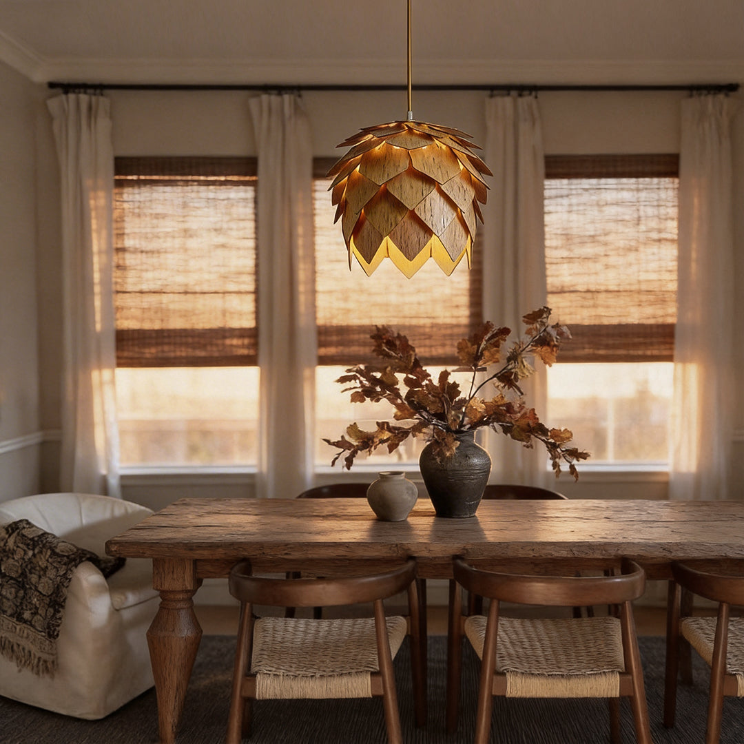Pinecone pendant light with a natural wooden design, providing warm illumination above a rustic dining table.