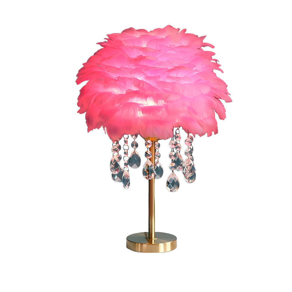 Pink feather table lamp with gold base shown as standalone product.