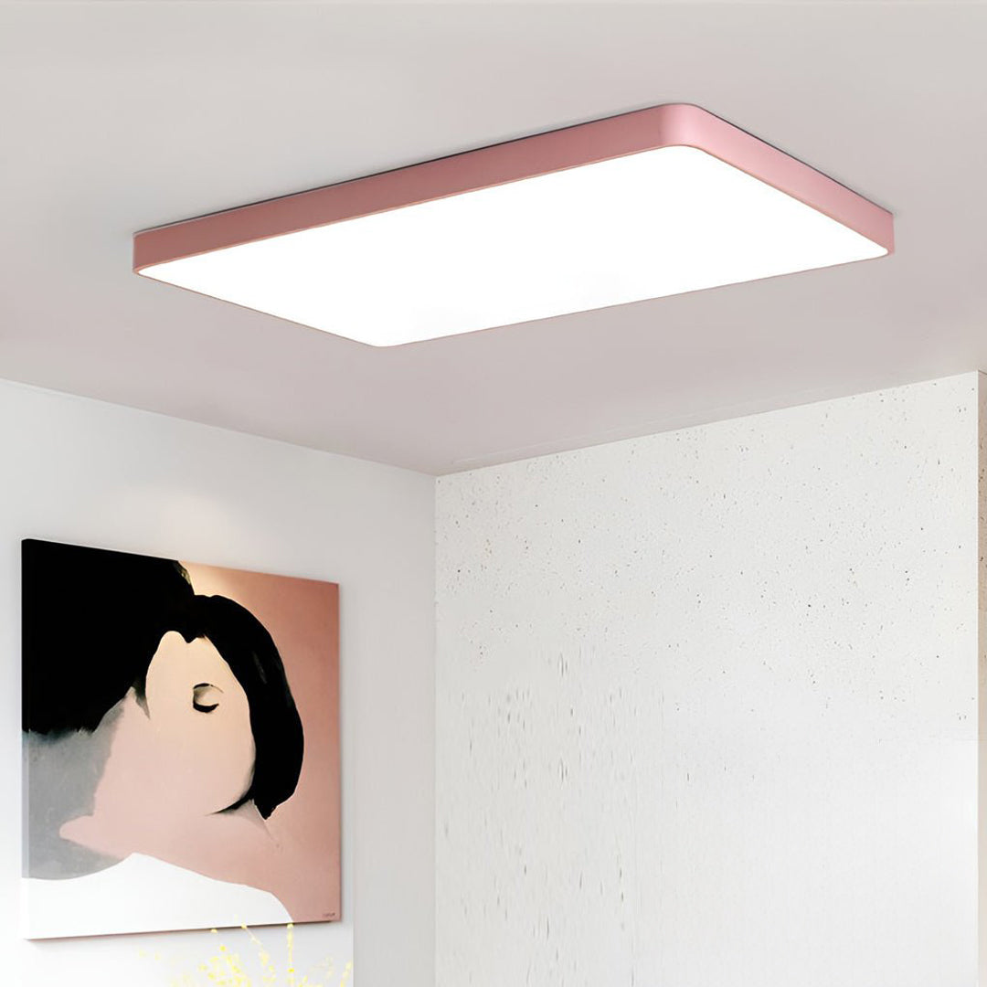 Pink square ceiling light paired with contemporary wall art.