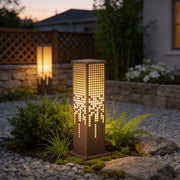 Pixel bollard lamp illuminating a modern garden pathway with elegant pixelated light design.