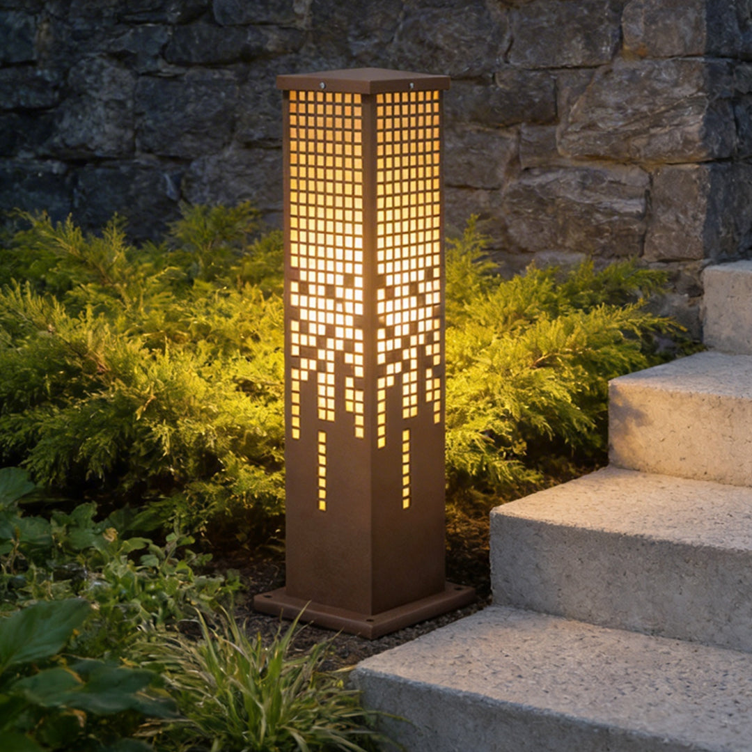 Pixel bollard lamp providing soft illumination along a stylish driveway.
