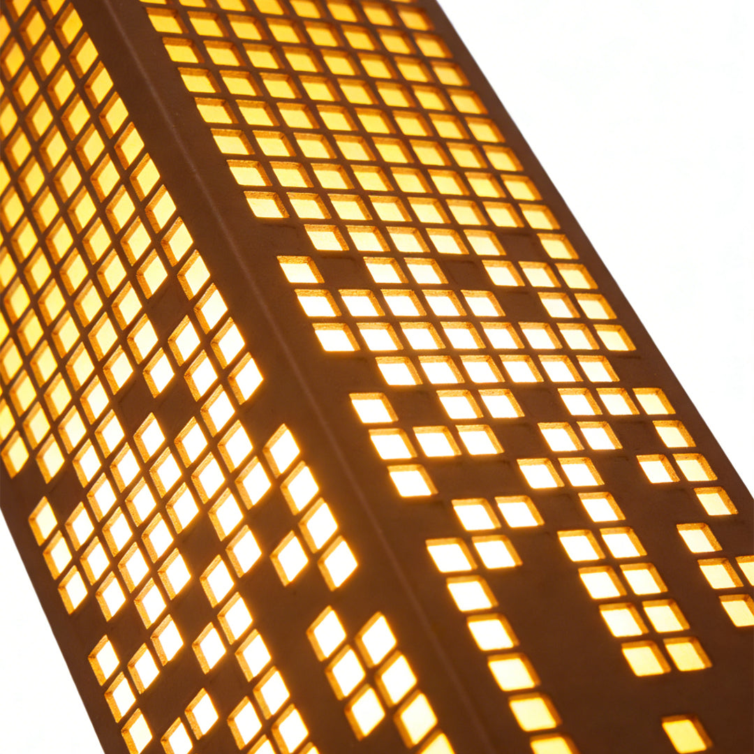 Pixel bollard lamp enhancing a stylish outdoor area with warm light.