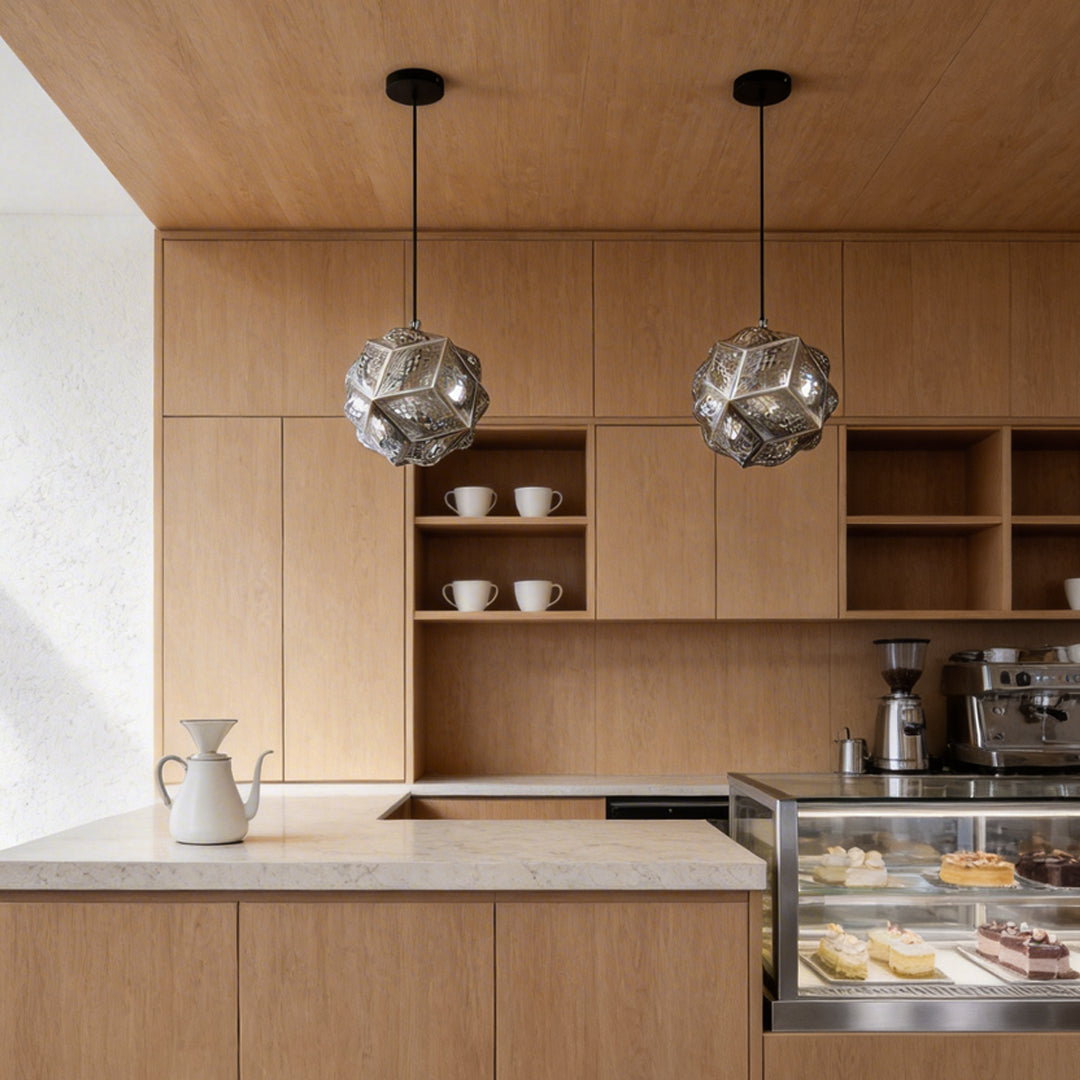 Polyhedron pendant light with a geometric design, hanging above a modern kitchen island.