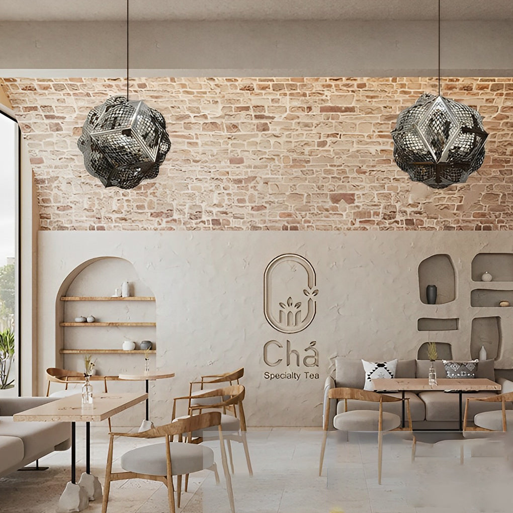 Polyhedron pendant light with a sleek black finish, hanging above a modern sofa.