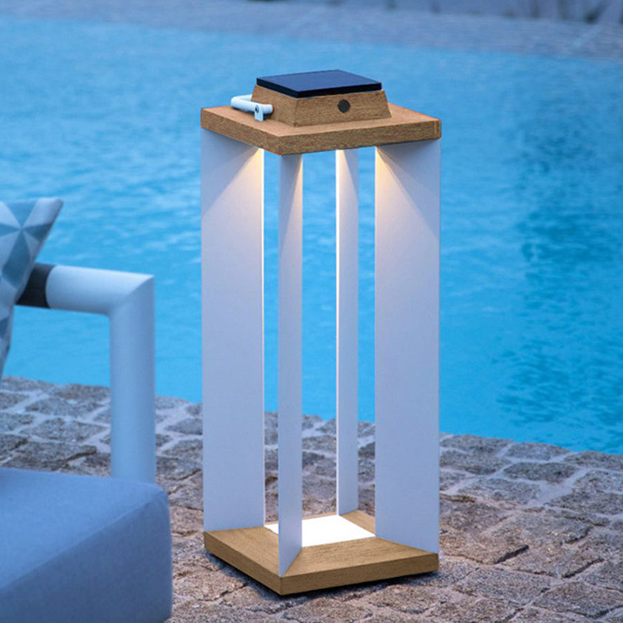 Single wooden solar lantern with blue-tinted light creating serene poolside ambiance