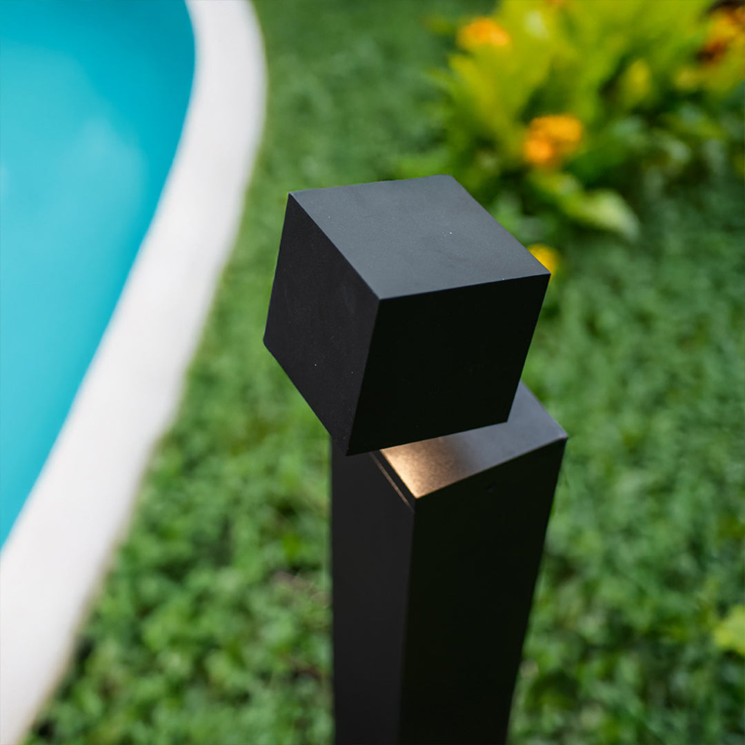 Contemporary pathway outdoor lights enhancing poolside area with modern design and warm ambient lighting