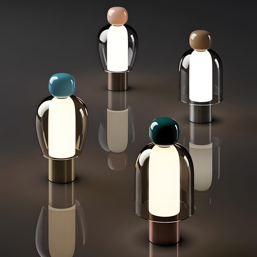 Portable glass table light in gold, front view of the sleek design.