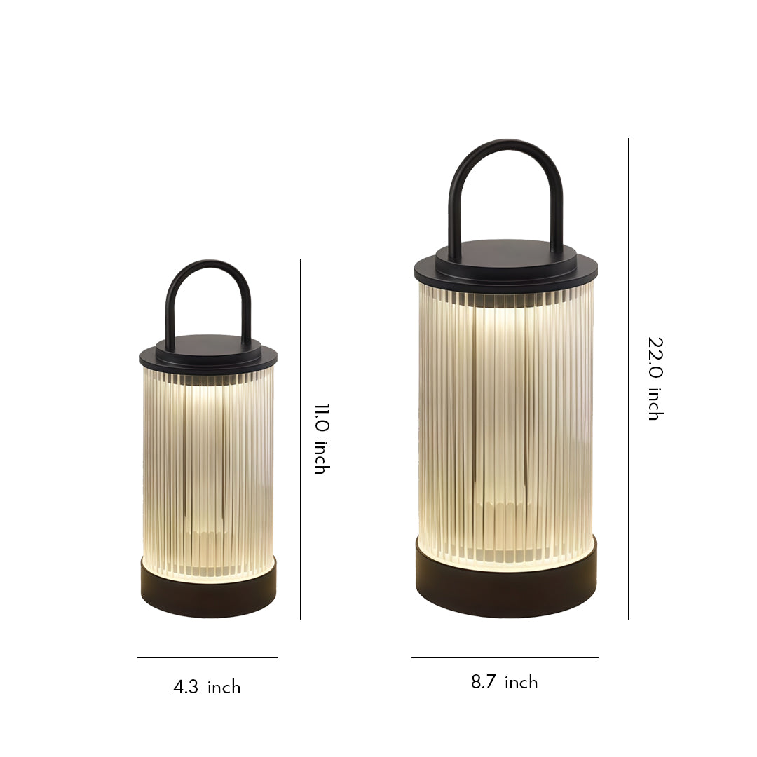 Compact portable lantern with frosted cylindrical shade and minimal handle against white background.