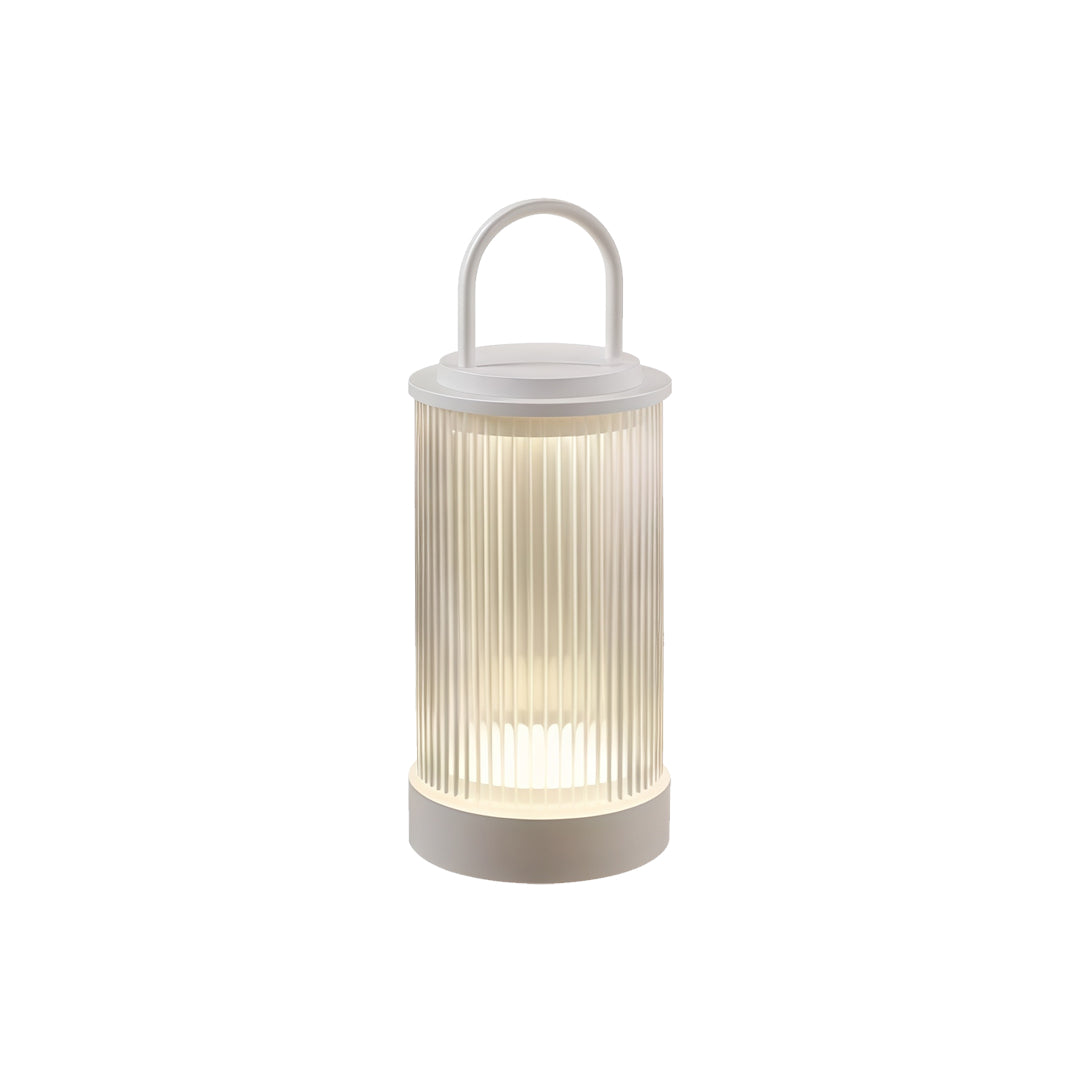 Slim portable lantern standing upright with ribbed light diffuser and metal accent handle.