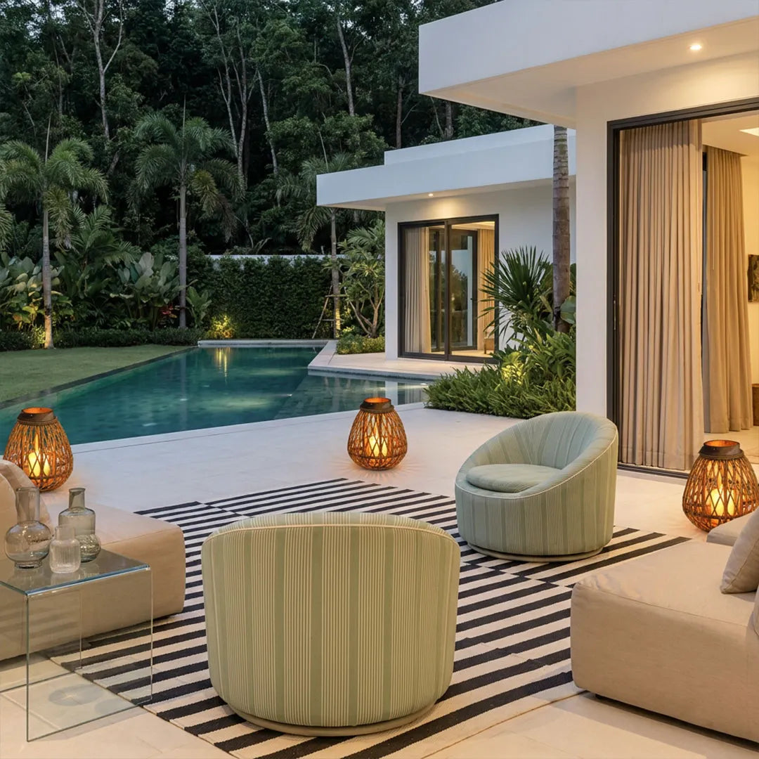 Portable LED lanterns illuminating a modern poolside patio with warm decorative lighting.