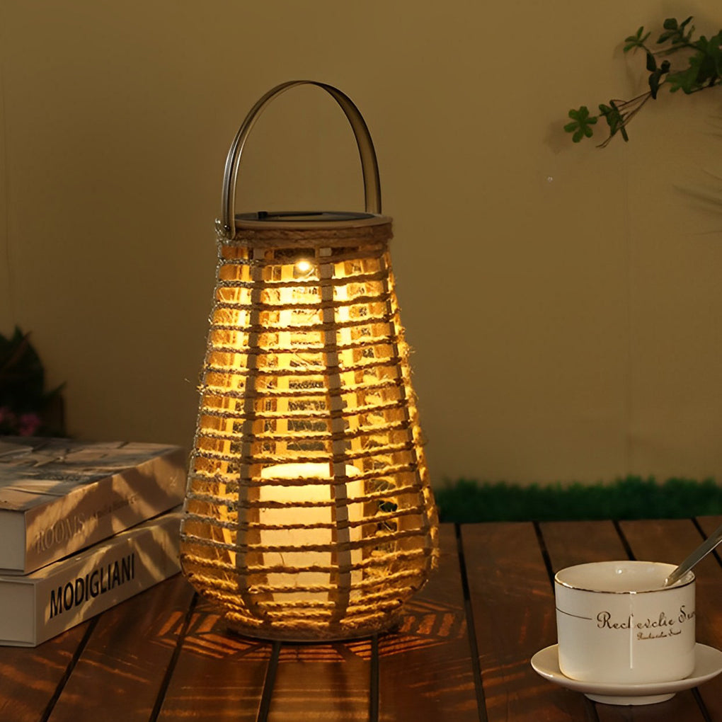 Portable rattan solar lantern with handle used as outdoor table lighting.