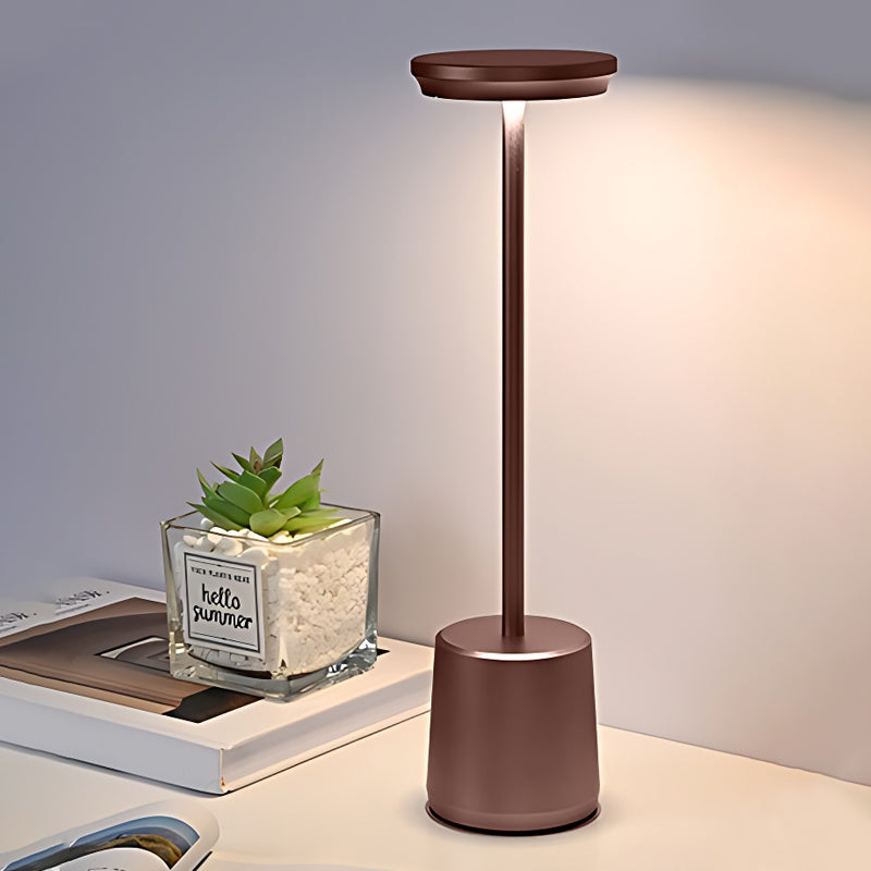 Portable rechargeable LED table lamp with a close-up of the illuminated light head.