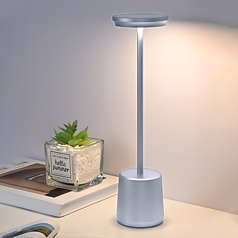 Portable rechargeable LED table lamp with a close-up of the sleek, golden design.