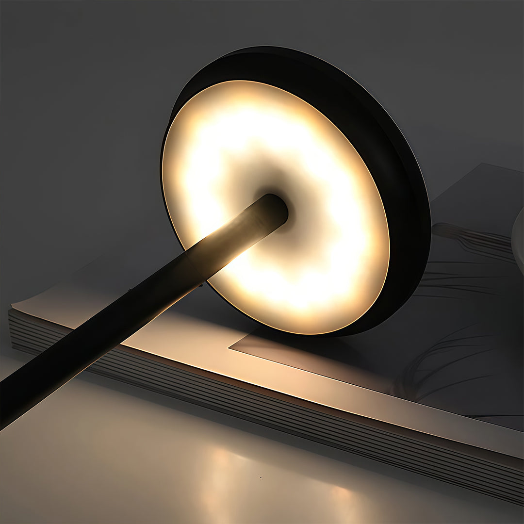 Portable rechargeable LED table lamp in gold, side view of the elegant design.