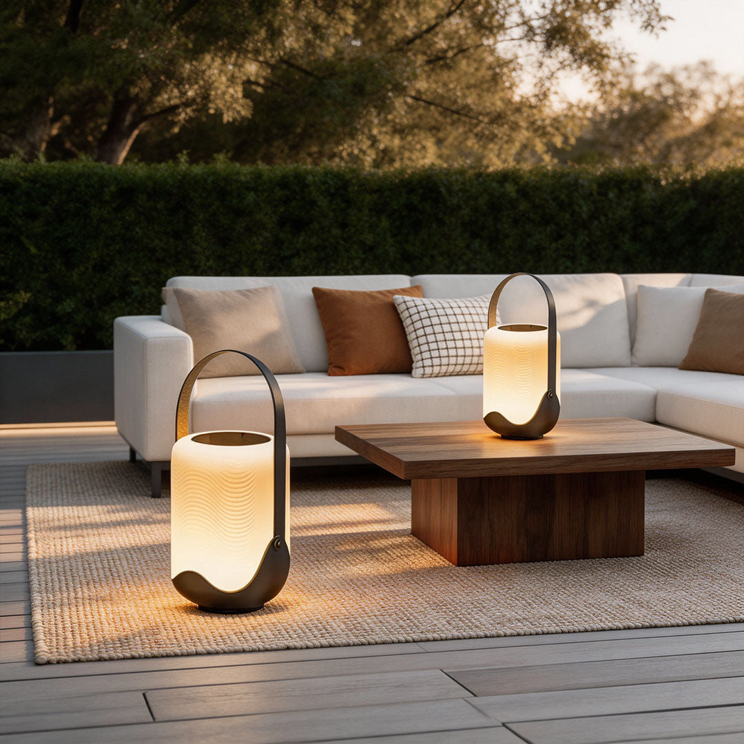 Portable solar lanterns with a contemporary design, enhancing an outdoor living space.