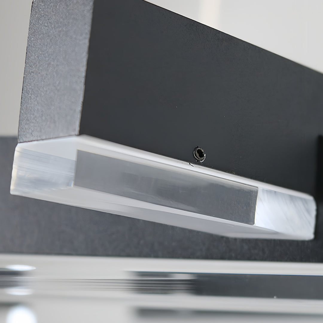 Close-up detail of small black pendant light showing precision-engineered geometric construction