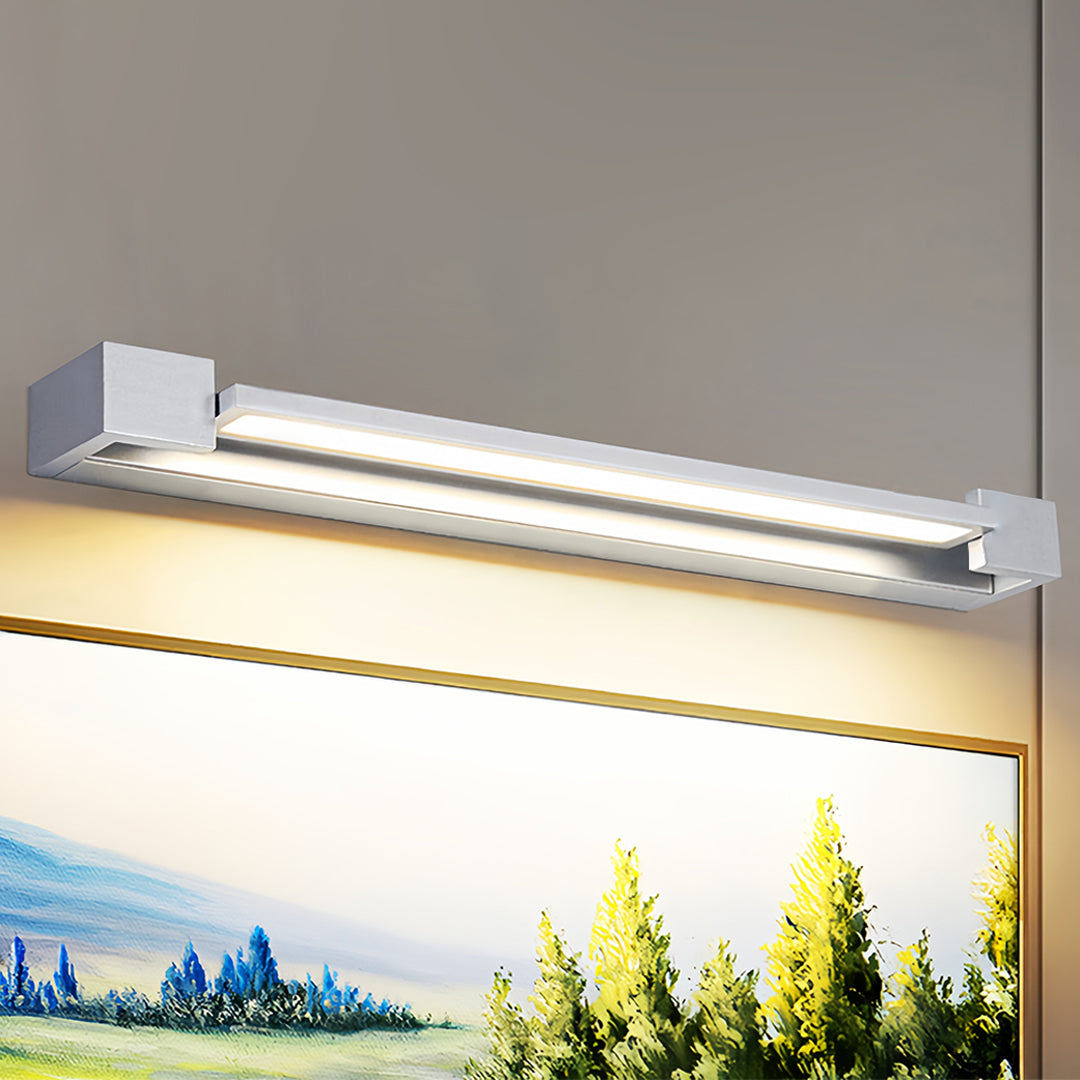 Premium chrome bathroom vanity light illuminating artwork with focused directional lighting