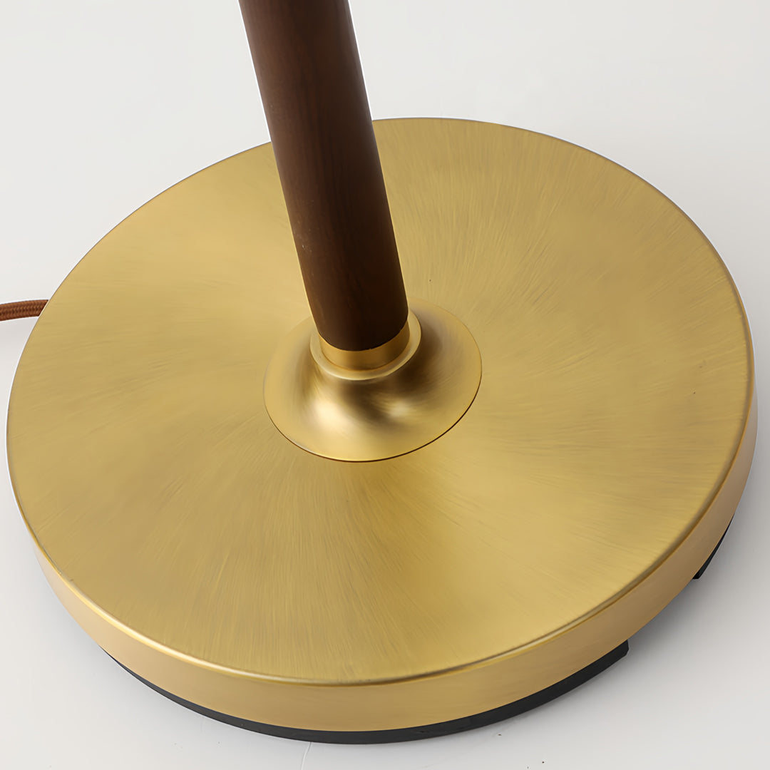 Premium floor wood lamp base detail showing quality brass construction and circular weighted design