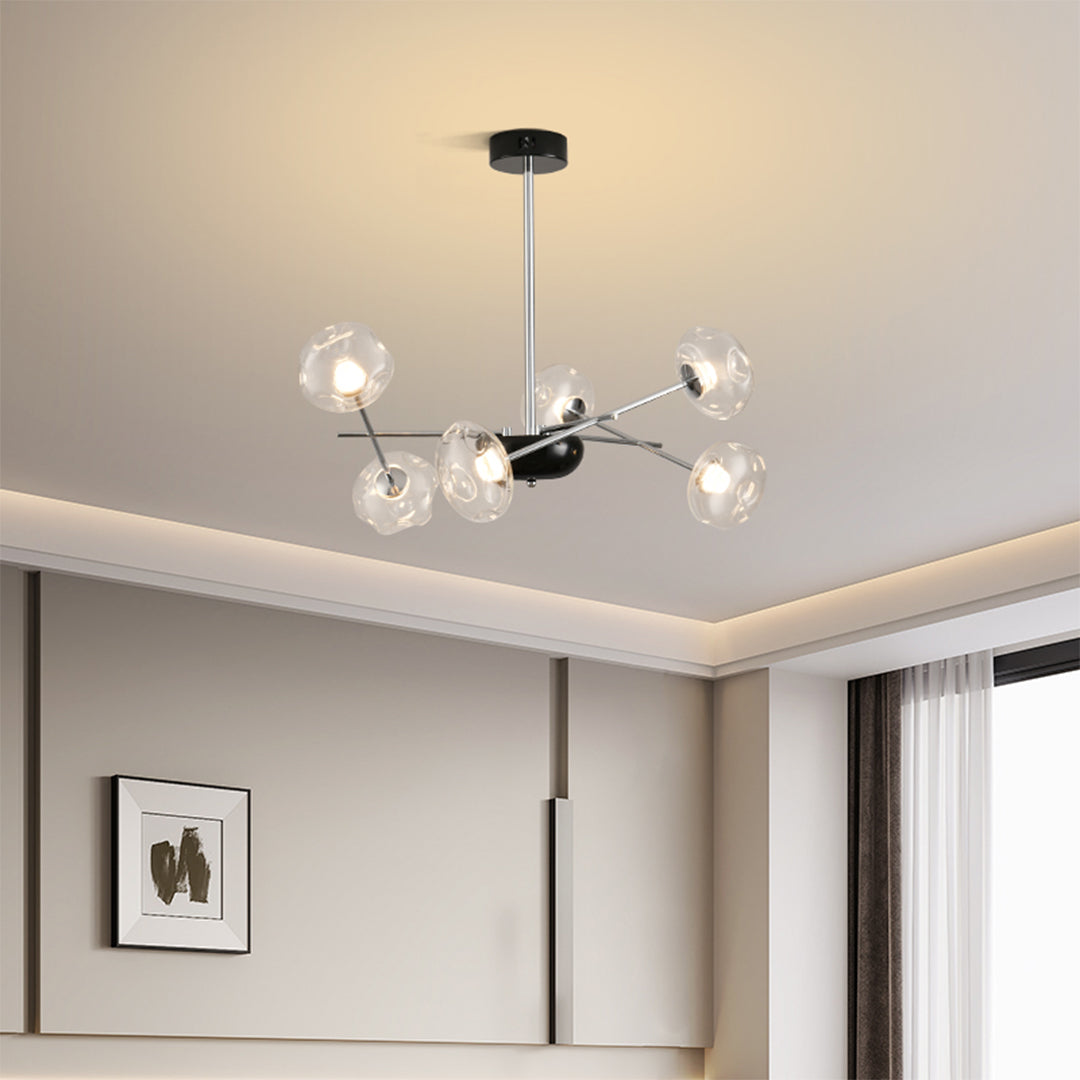 Premium LED chandelier lights with multiple glass orbs illuminating modern kitchen and dining area