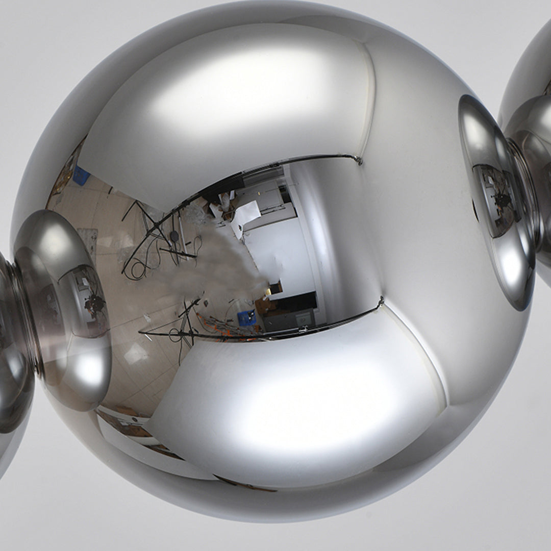 Premium silver pendant light for kitchen island detail view of mirror-finish spherical shade with elegant design