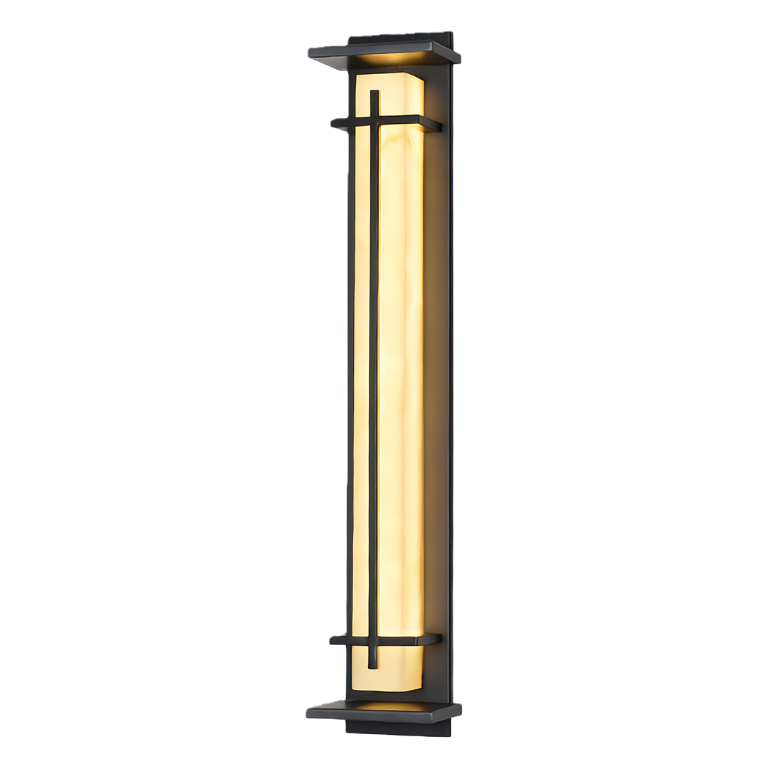 Product image of a sleek black outside wall light, illuminated to show its warm white light output.