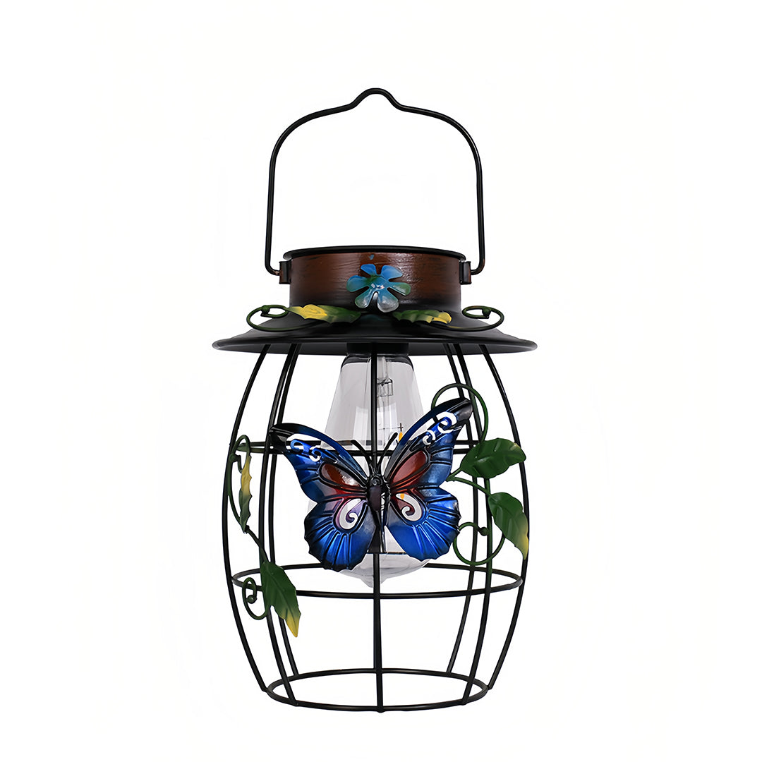 Product shot of the metal cage iron outdoor lanterns with painted butterfly and solar panel on white background.