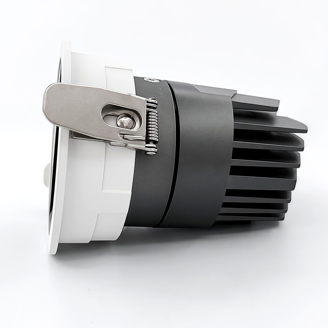 Professional adjustable spotlights module with exposed heatsink and glass shade chandelier reflector for commercial applications.