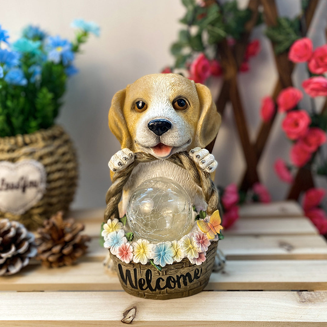 Puppy welcome statue with illuminated flower basket displayed on wooden surface indoors