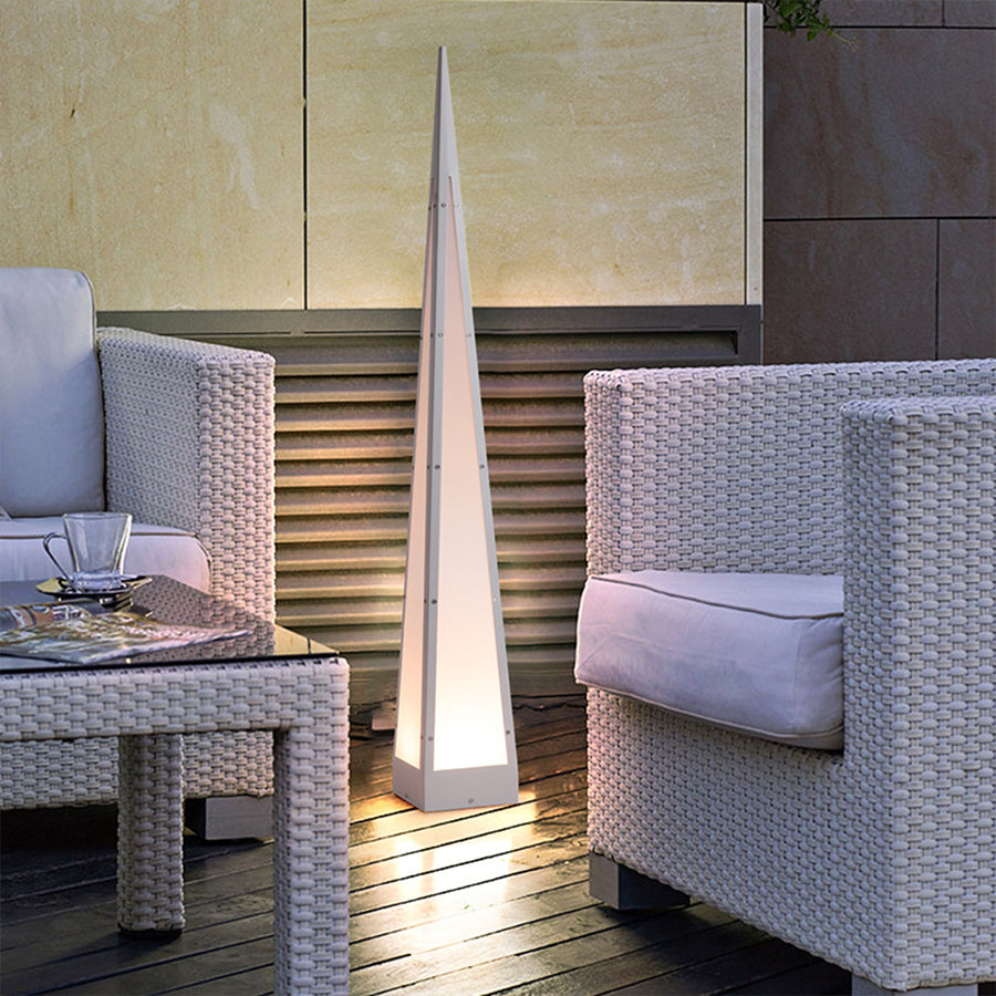 Contemporary pyramid floor lamps providing atmospheric lighting in modern living space