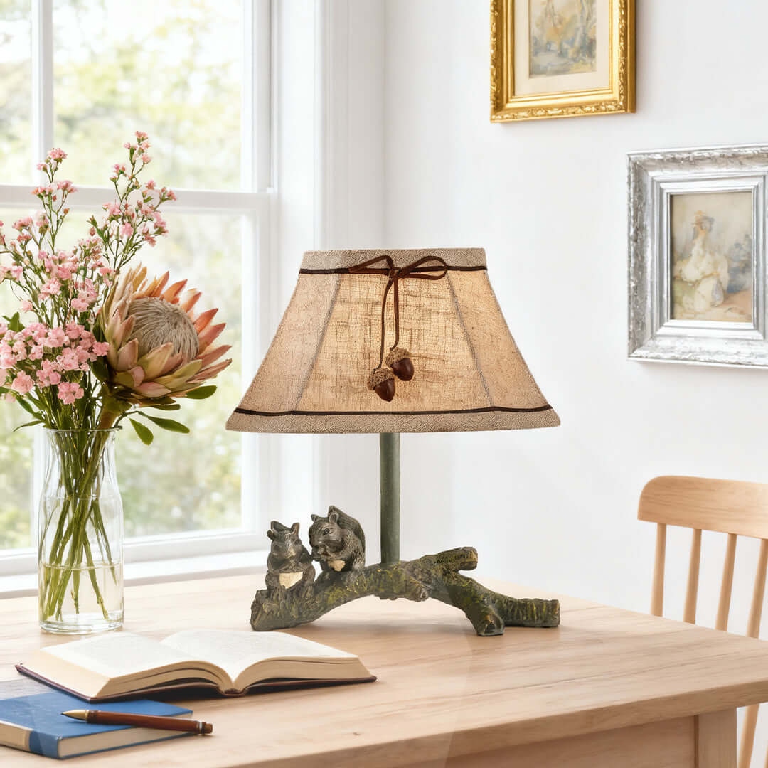 Quaint squirrel table lamp with a textured shade and rustic branch base, adding a nature-inspired element to a sunny room.