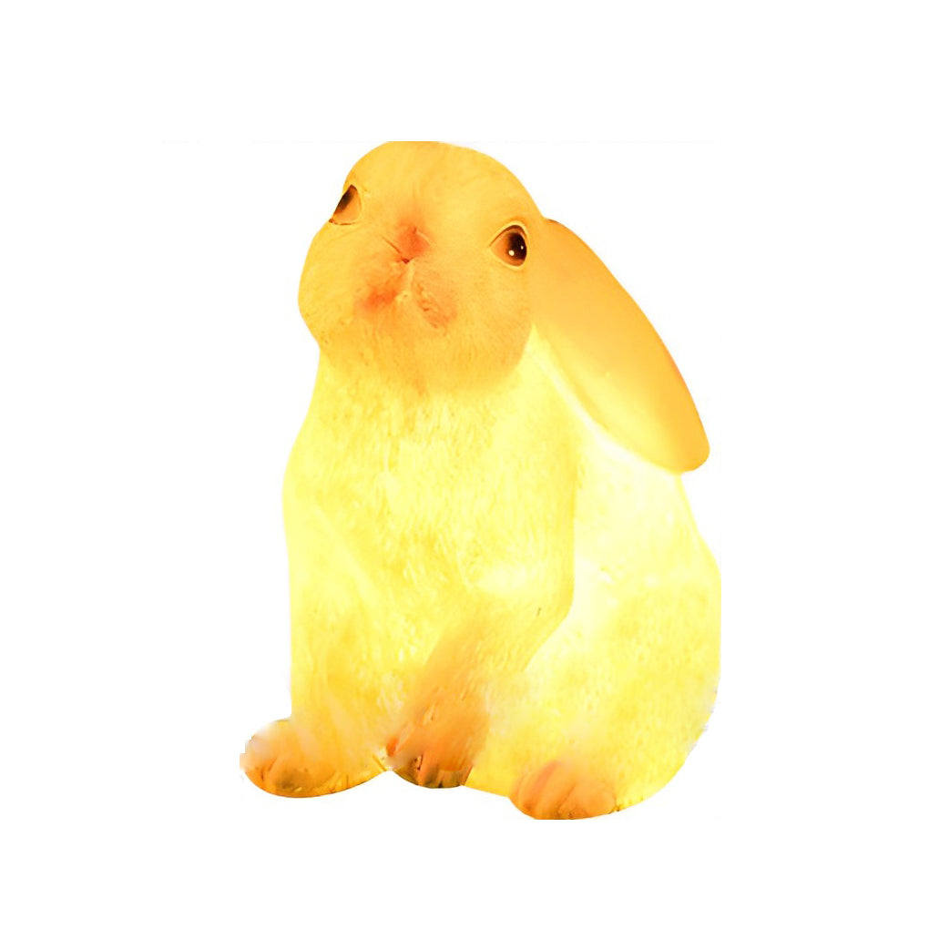 Rabbit garden light in a soft yellow hue, showcasing its charming and minimalist silhouette.