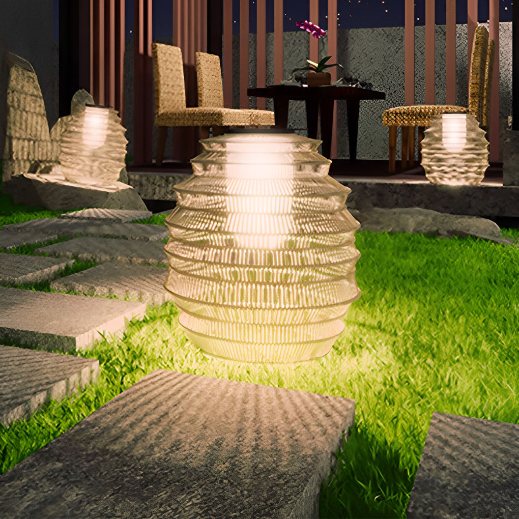Rattan outdoor lantern with a close-up of its layered woven structure.