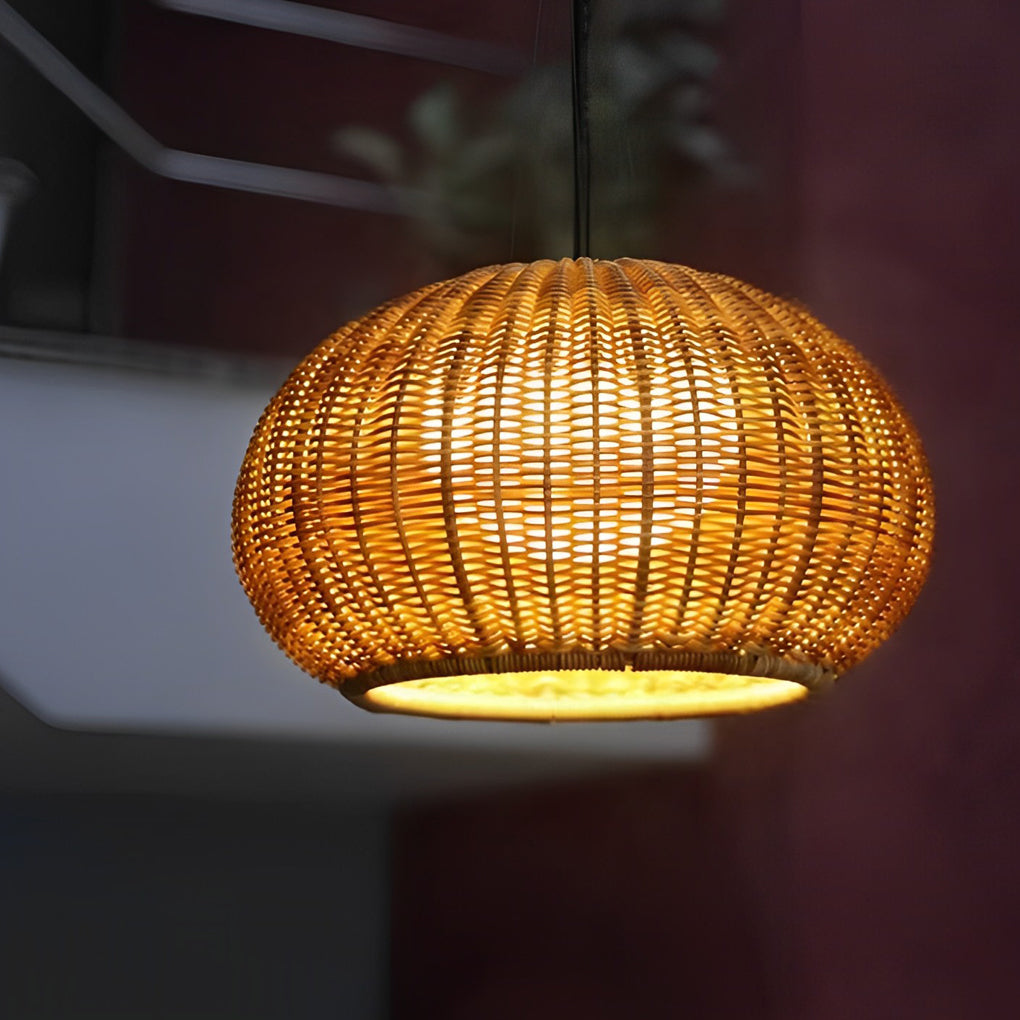 Rattan outdoor pendant light providing elegant illumination above a sofa in a living area.