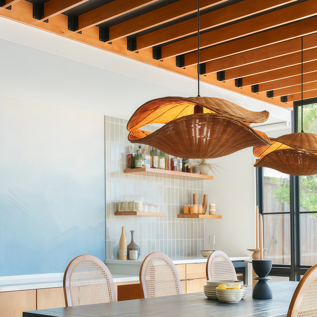 Rattan pendant light in a modern kitchen, providing functional and decorative lighting in a spacious room.
