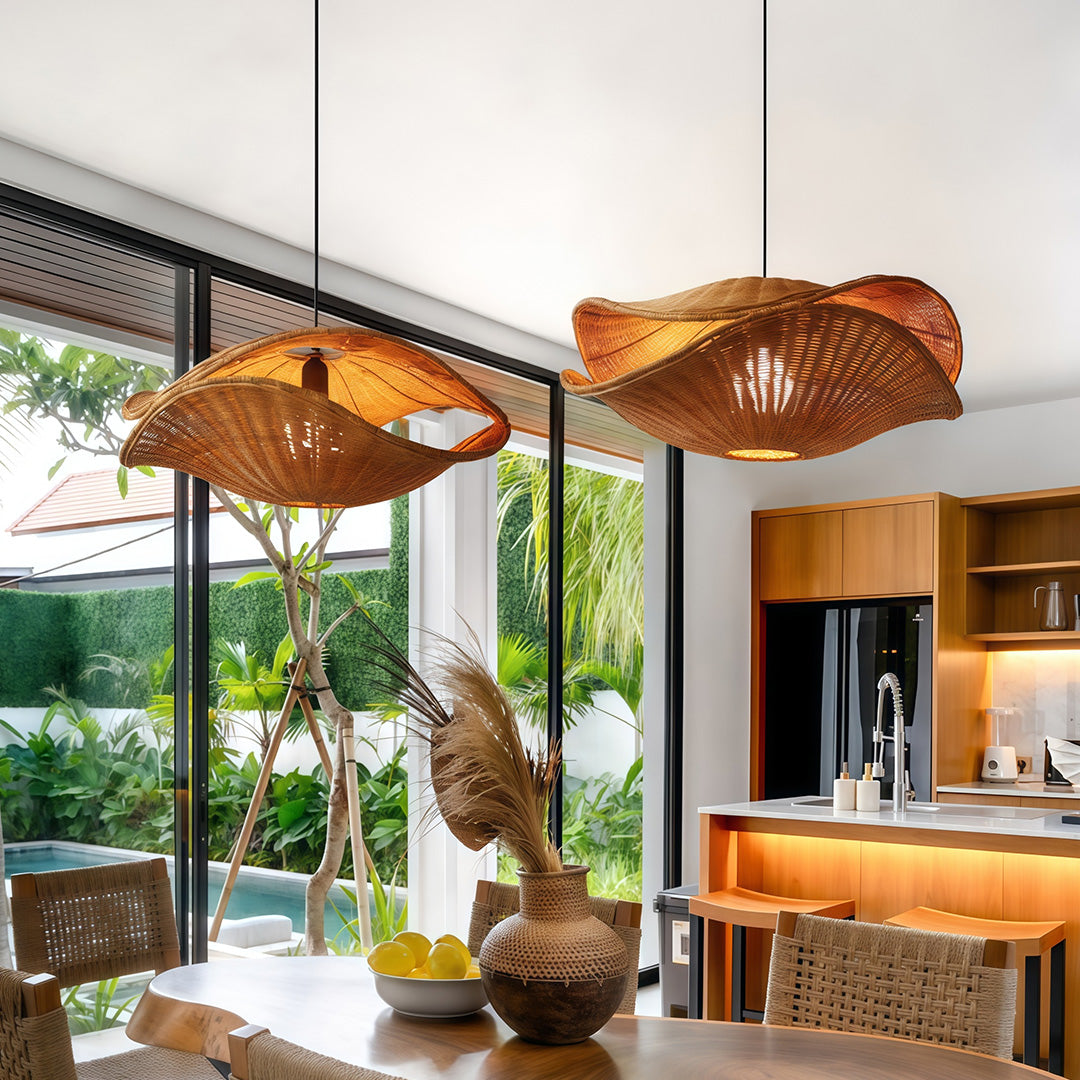 Rattan pendant lights installed above a kitchen island, offering a warm, organic touch to a modern space.
