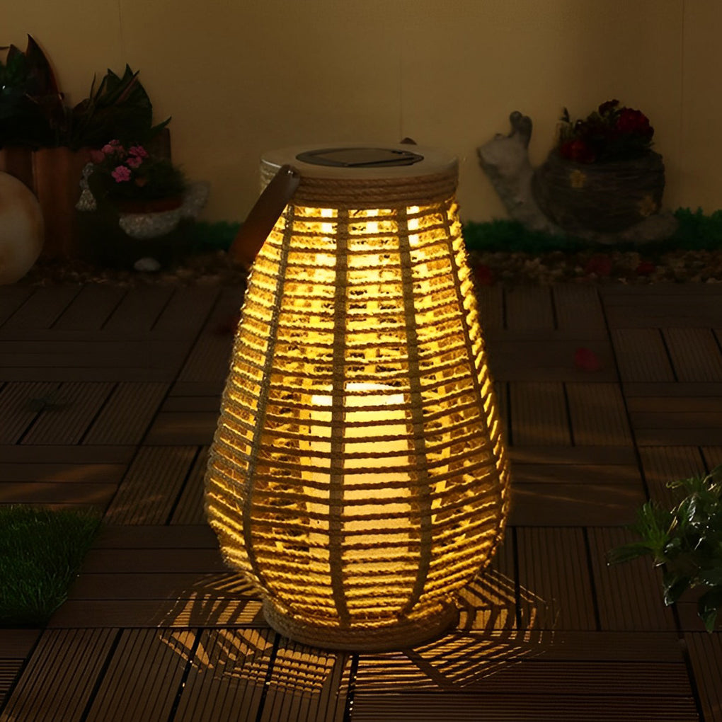 Rattan solar lantern glowing on outdoor table for garden night decoration.