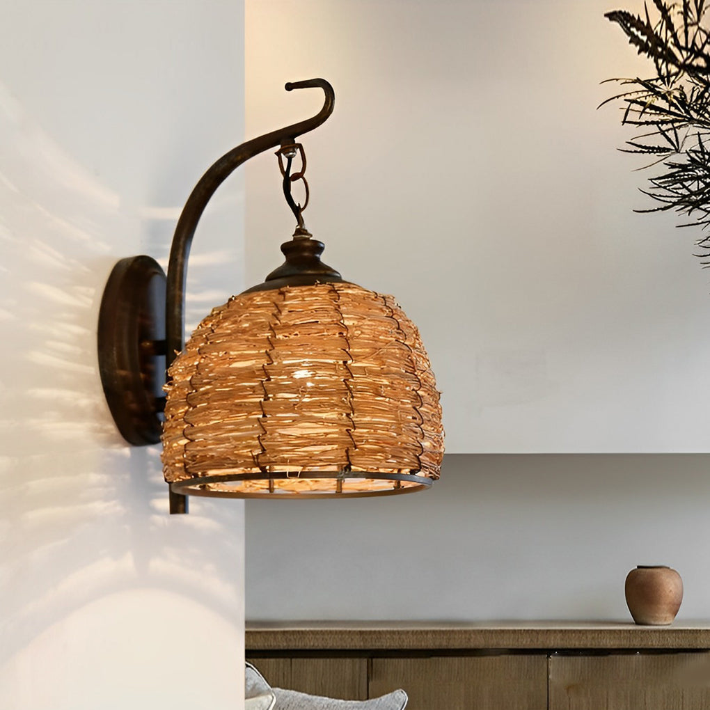 Rattan wall lamp with a detailed view of its woven rattan shade.