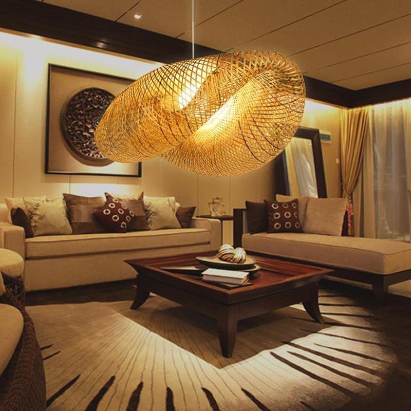 Rattan wave pendant light installed in a warm living room with wood furniture.