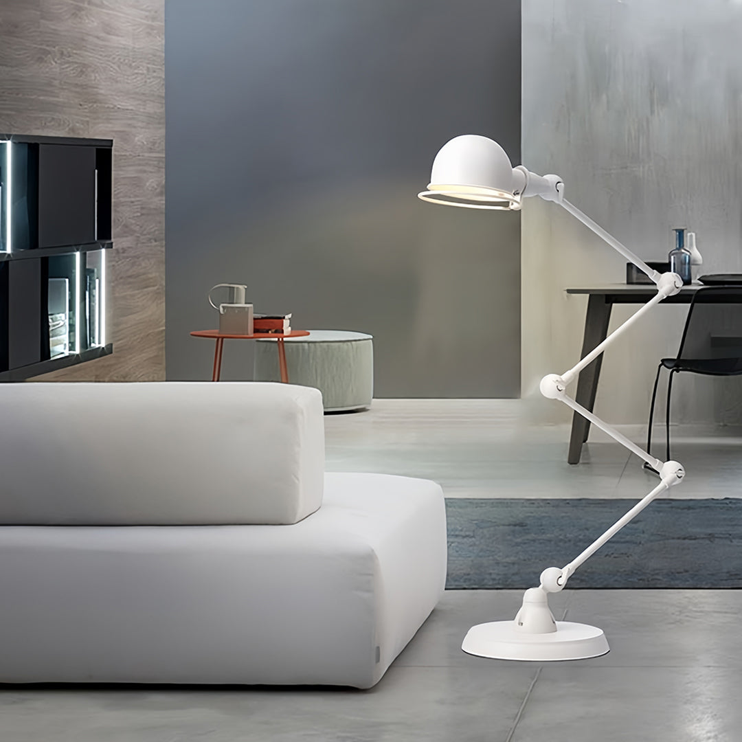 Reading floor lamps for living room positioned beside modern gray sofa creating perfect ambient and task lighting
