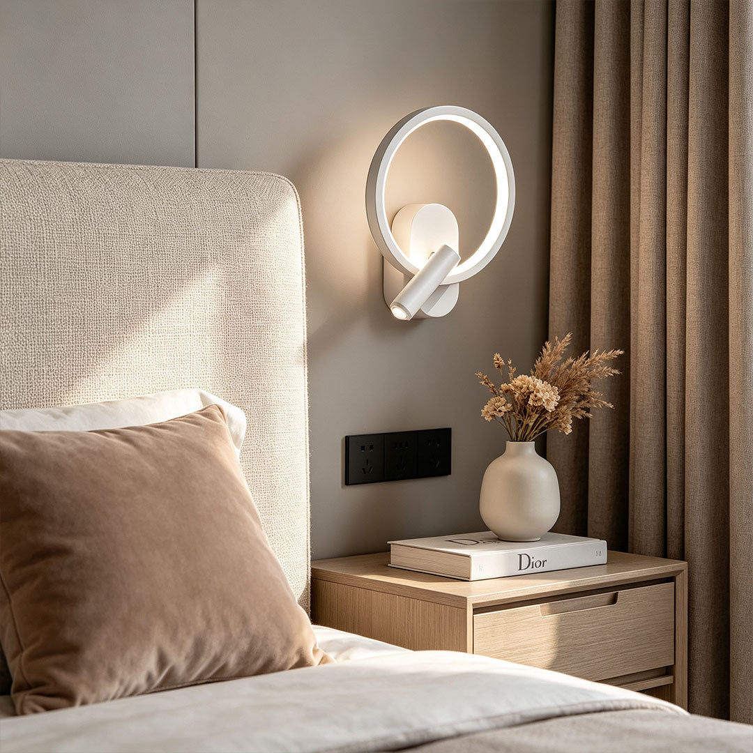 Stylish reading light for bed wall mounted beside bedside table with warm LED ring illumination.